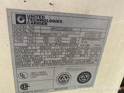 Carrier condenser nameplate showing model and serial number